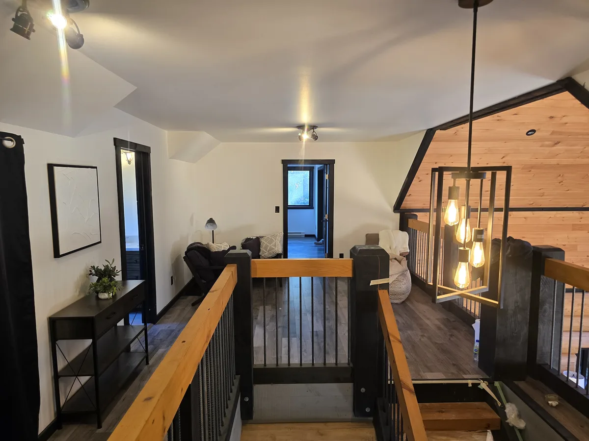 Swapped a tired, dated tone for a modern, light-reflecting finish. This update completely changed the loft's presence, maximizing brightness and providing a clean, welcoming environment that looks refreshed and welcoming.