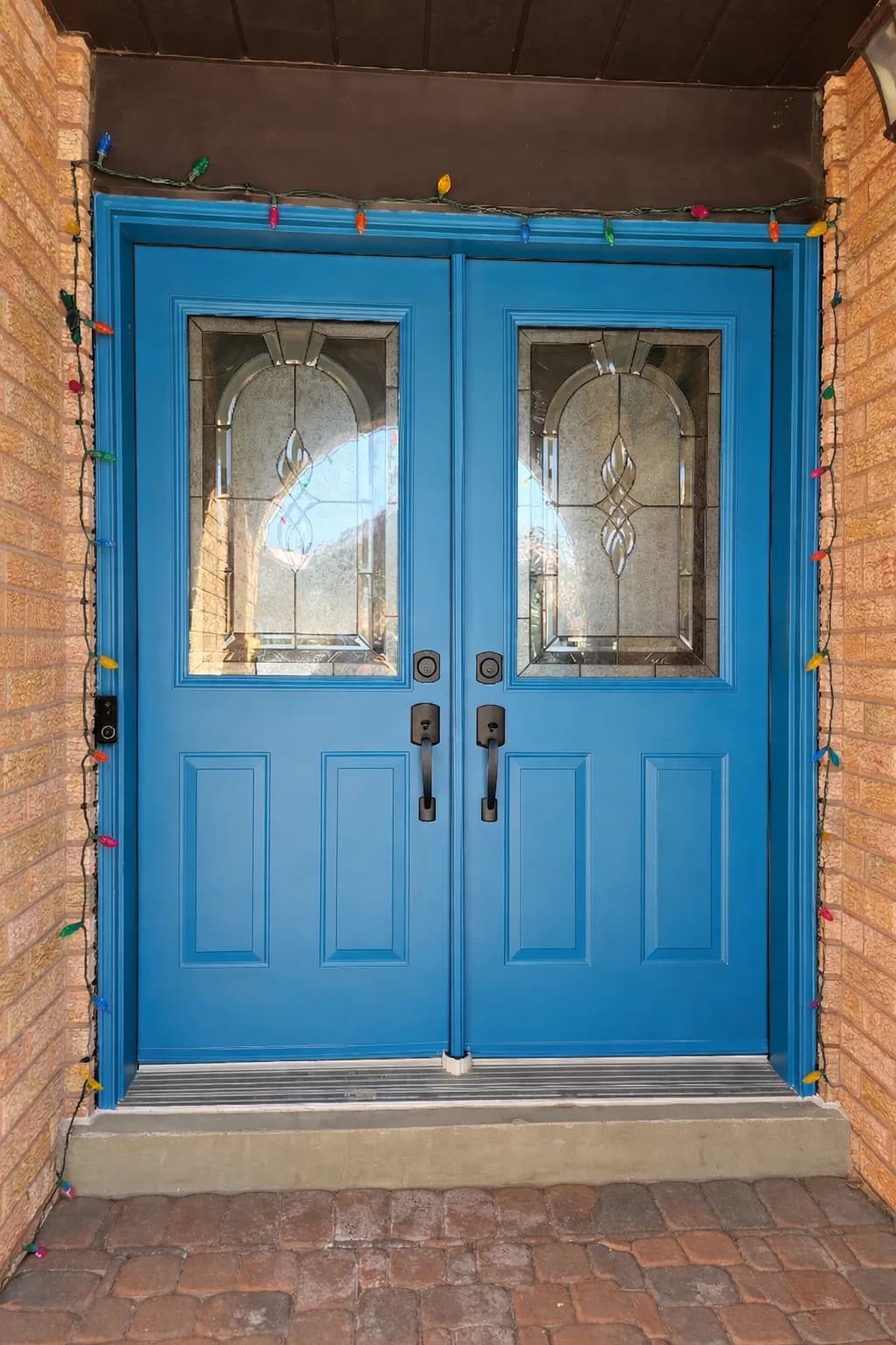 From faded to refreshed. We restored these front doors with a rich, vibrant blue to match the owner’s style and give the home a fresh, energized look.